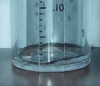Rain gauge showing a trace amount of rainfall less than 0.01 inch.